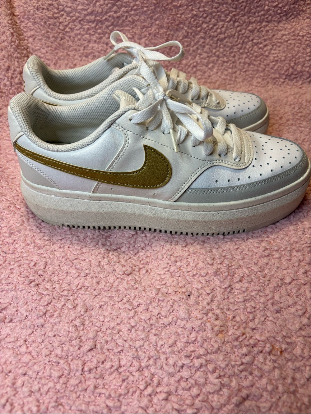 Nike Women’s White Platform Sneakers with Gold Swoosh Accent